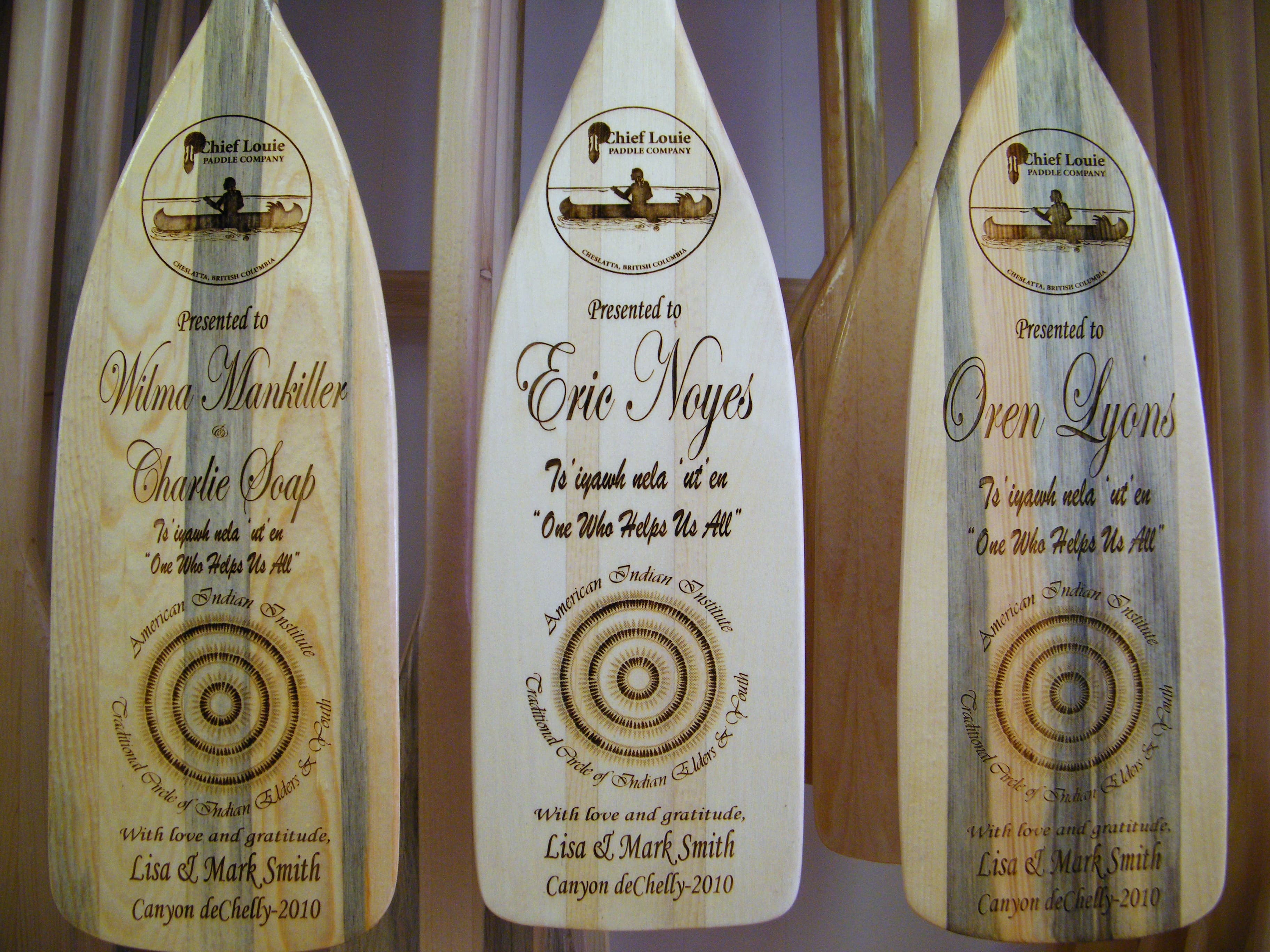 Collection of handcrafted canoe paddles